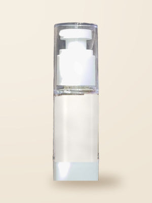 The travel mini of the leave in conditioner, a small clear pump bottle of milky white conditioner